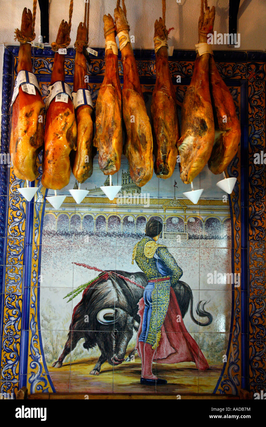 Cured Ham hanging at a tapas bar Seville Spain Stock Photo Alamy