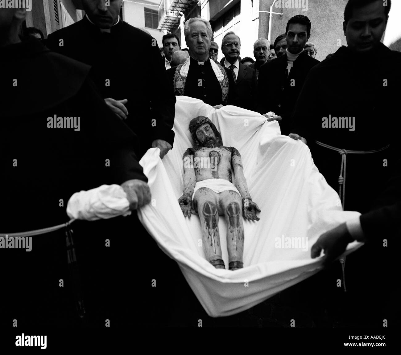 The statue of Christ is carried by priests in the streets of Corleone Sicily Italy Stock Photo
