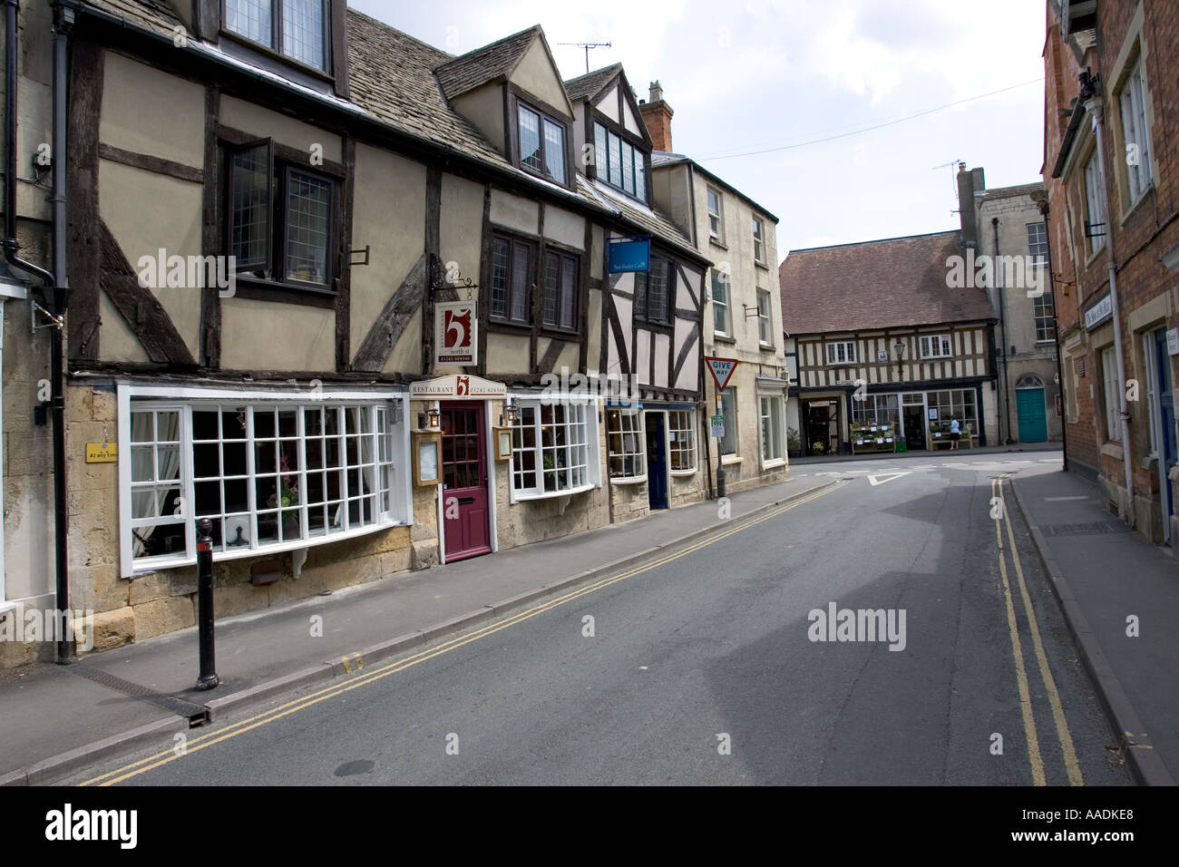 Main street in the Saxon town of Winchcombe with Restaurant 5 and The George Hotel in the background Cotswolds UK Stock Photo