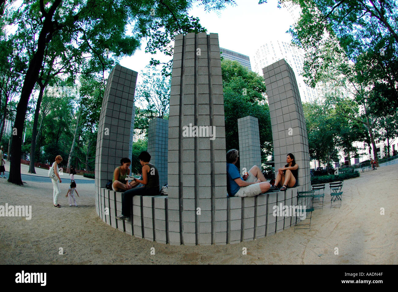 Visitors to Madison Square Park sit in Sol Lewitt s Circle With Towers  Stock Photo