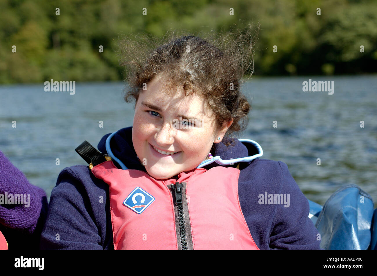 Young girl wearing a life jacket on electric boat on Coniston Water