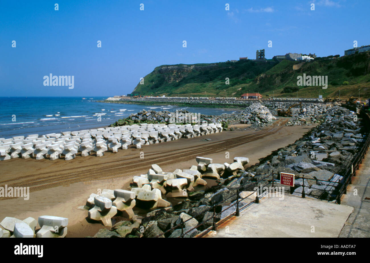 Reinforced concrete tetrapods & boulder rip rap on a beach, North Bay ...