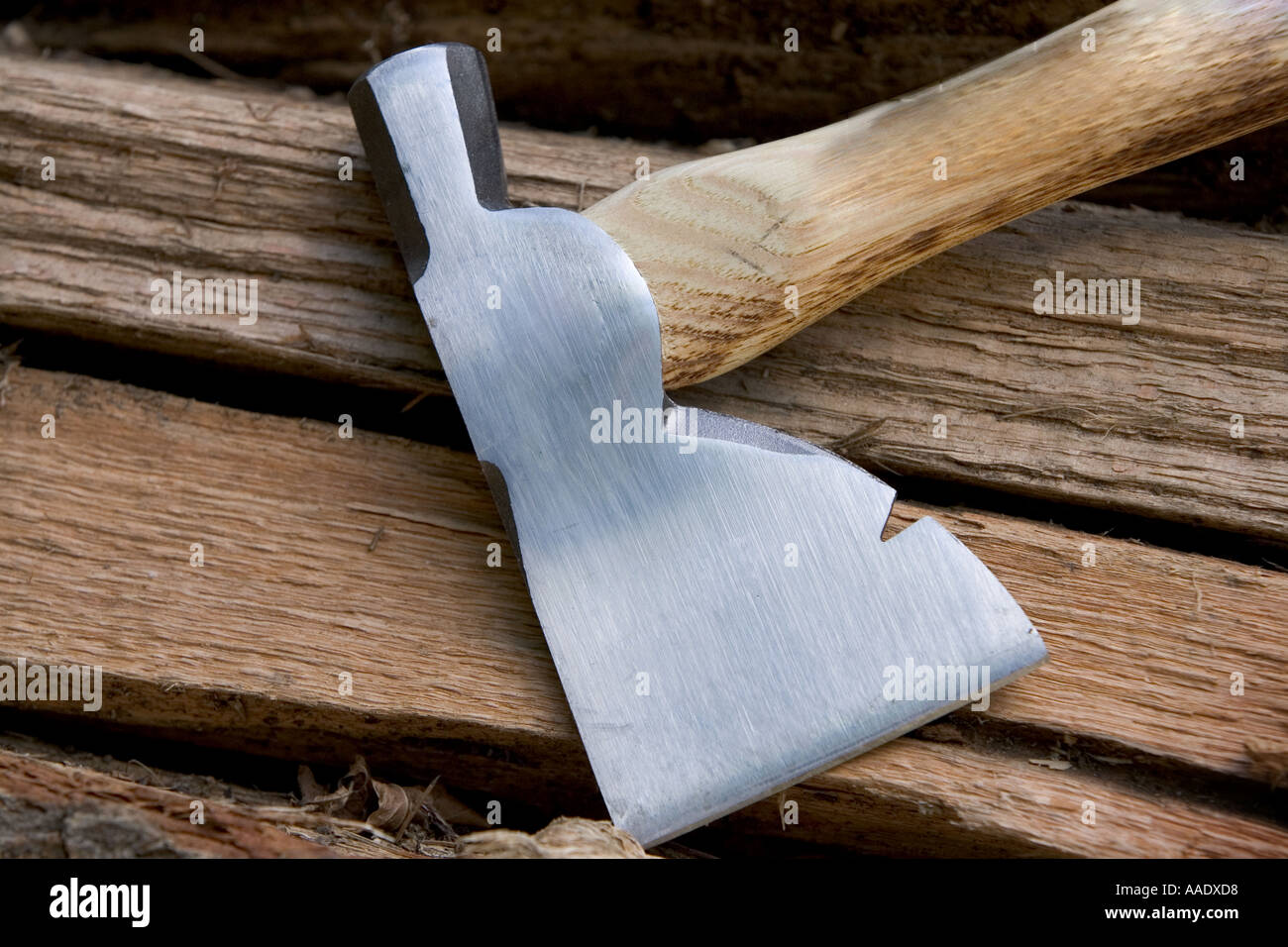 Axe on top of a pile of firewood Stock Photo