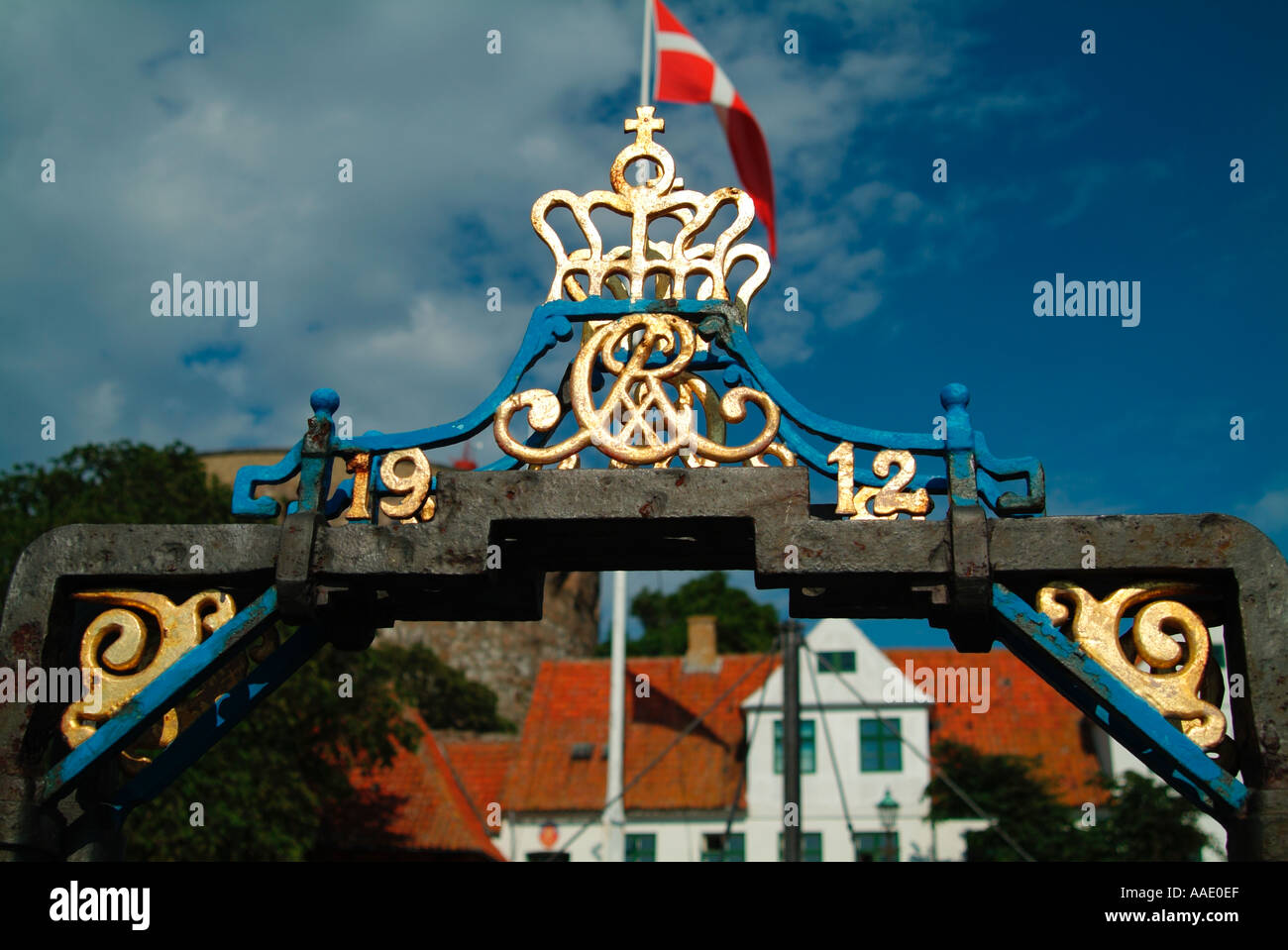 Close up of Danish Royal Crest on archway of wrought iron footbridge over the harbour of Christianso Island near to Bornholm Den Stock Photo