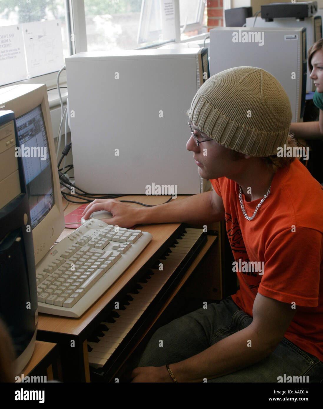 Male teenage Student with using computer in sixth form college Stock ...