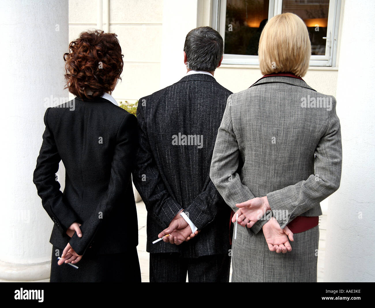 Smokers hiding their cigarettes Stock Photo Alamy