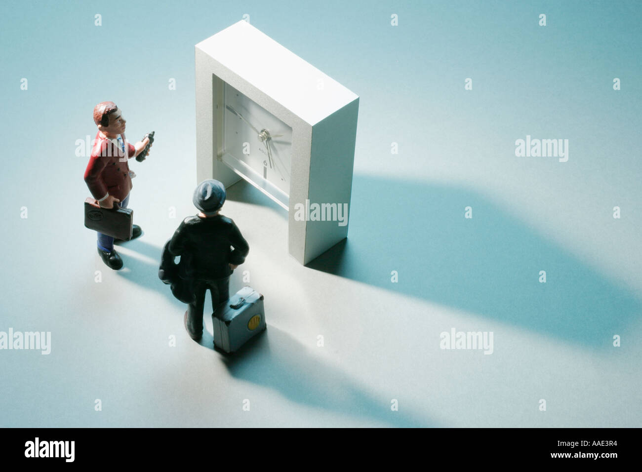 Businessman figures clock hi-res stock photography and images - Alamy