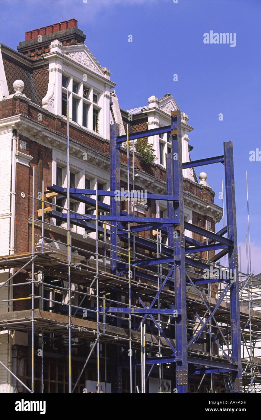 Shored up preserved brick facade of former Woodwards department store, Leamington Spa