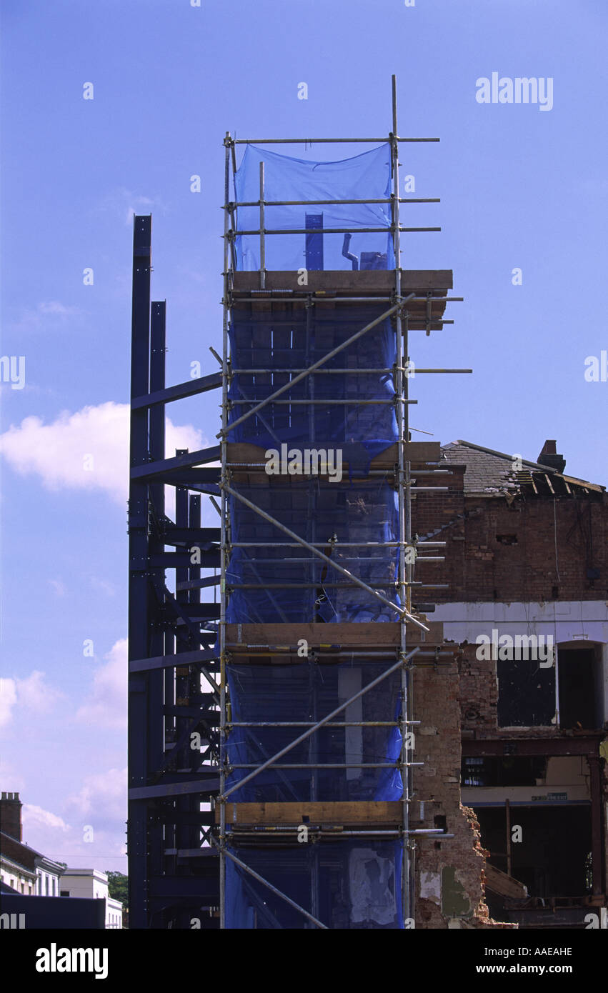Shored up preserved brick facade of former Woodwards department store, Leamington Spa