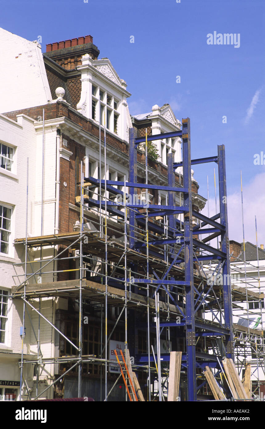 Shored up preserved brick facade of former Woodwards department store, Leamington Spa