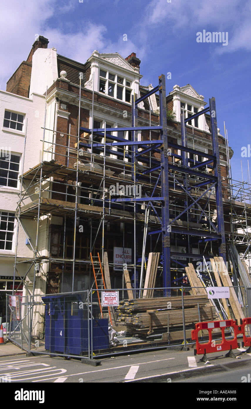 Shored up preserved brick facade of former Woodwards department store, Leamington Spa
