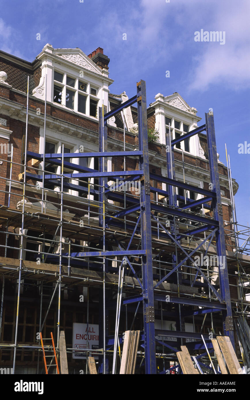 Shored up preserved brick facade of former Woodwards department store, Leamington Spa