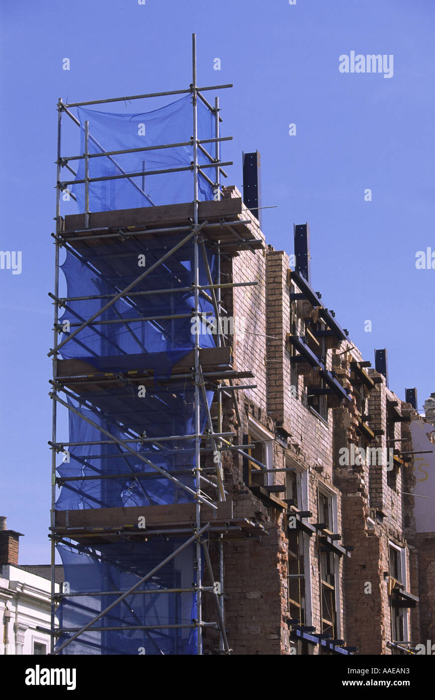 Shored up preserved brick facade of former Woodwards department store, Leamington Spa