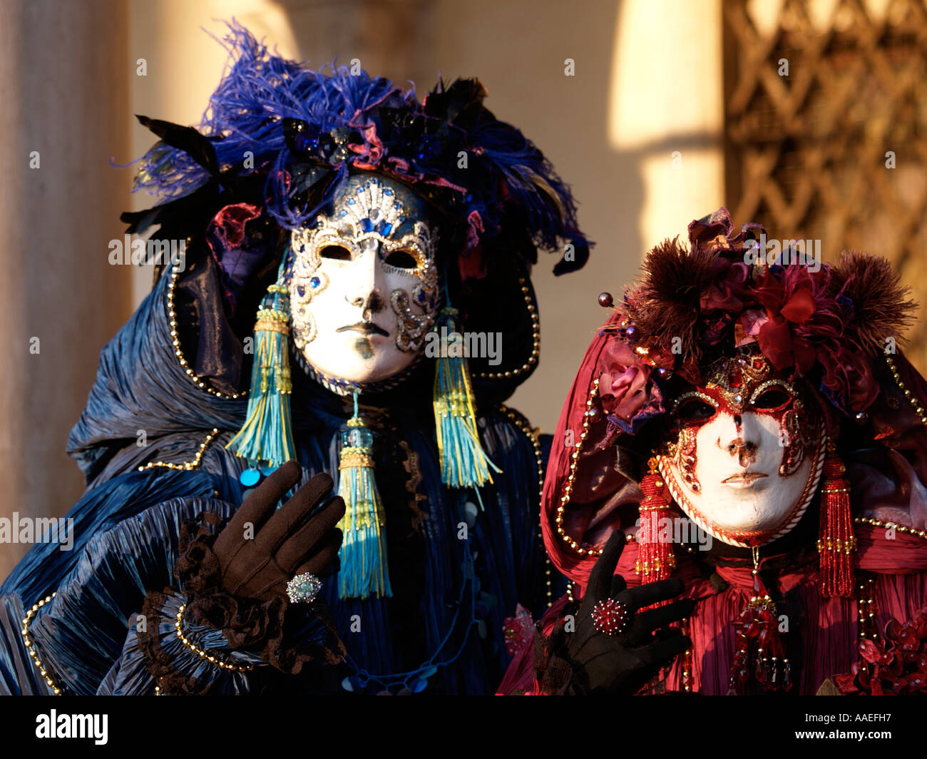 two people in red and blue costumes Venice carnival Stock Photo - Alamy