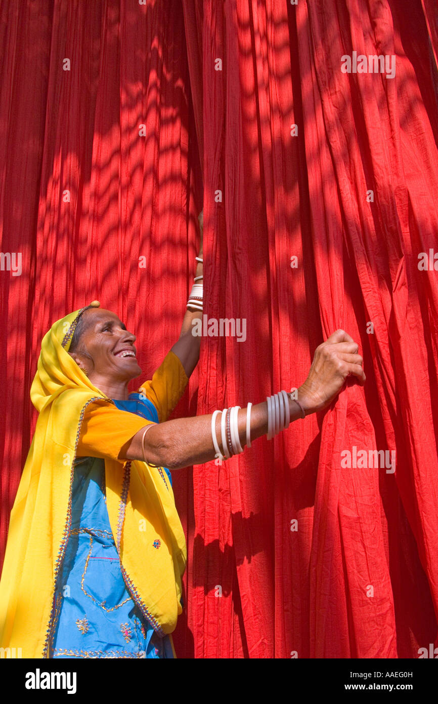 Woman dyring cloth at local fabric printing factory, Rajasthan, India MR Stock Photo