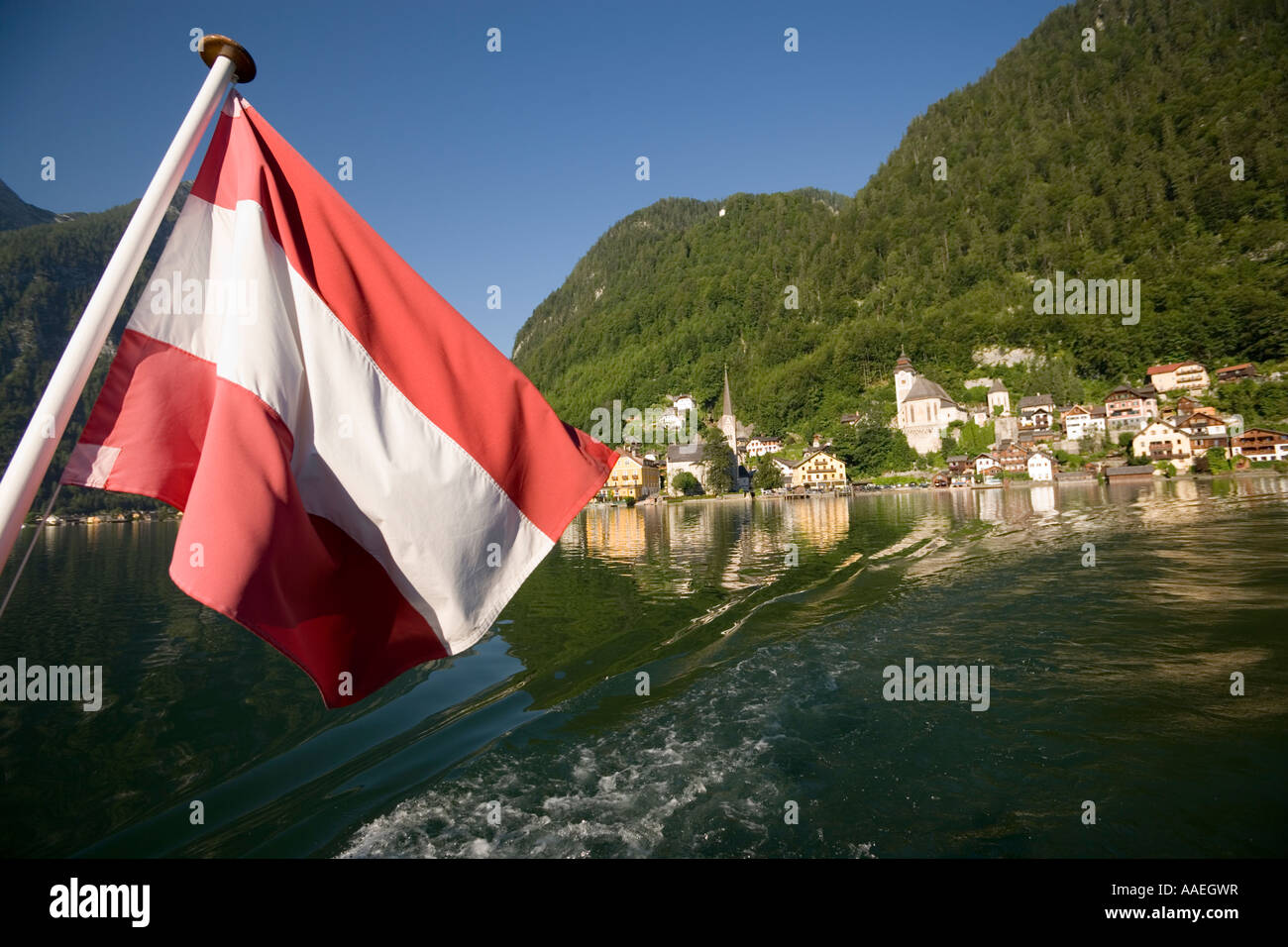 Austrian flag at stern of a ship on Lake Hallstatt Salzkammergut Upper ...