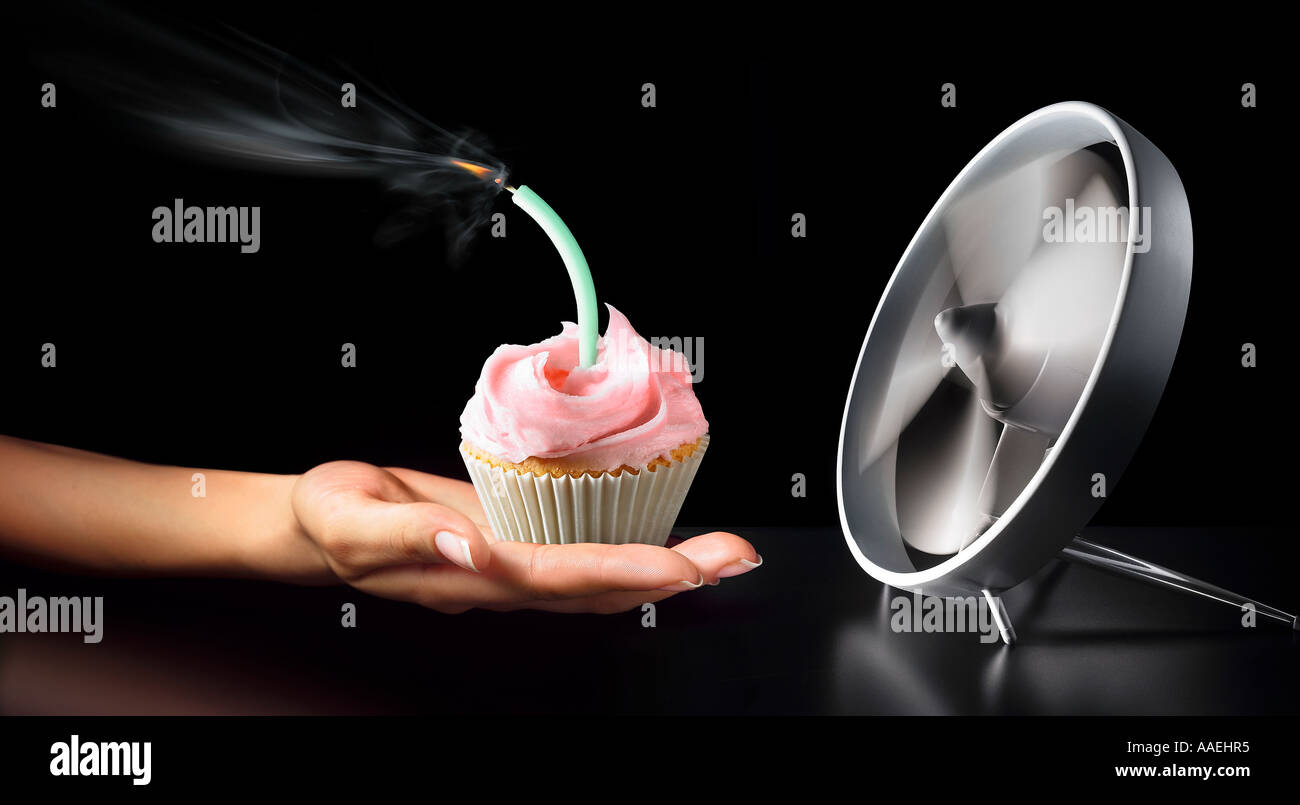 fan blowing out birthday candle Stock Photo Alamy
