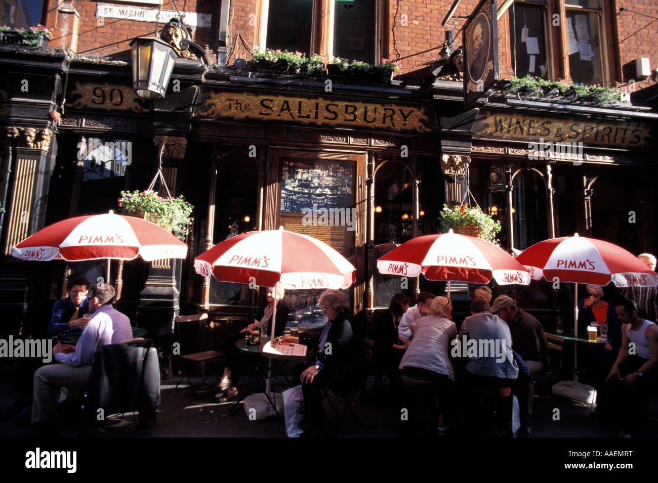 People sitting in front of The Salisbury Pub Soho London London England United Kingdom Stock Photo