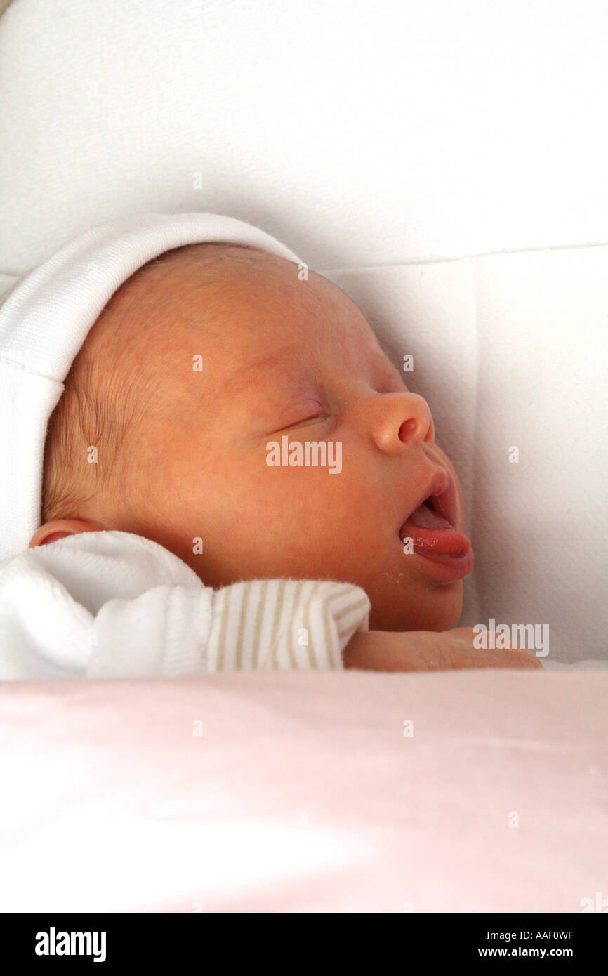 Baby girl asleep in cot hi-res stock photography and images - Alamy