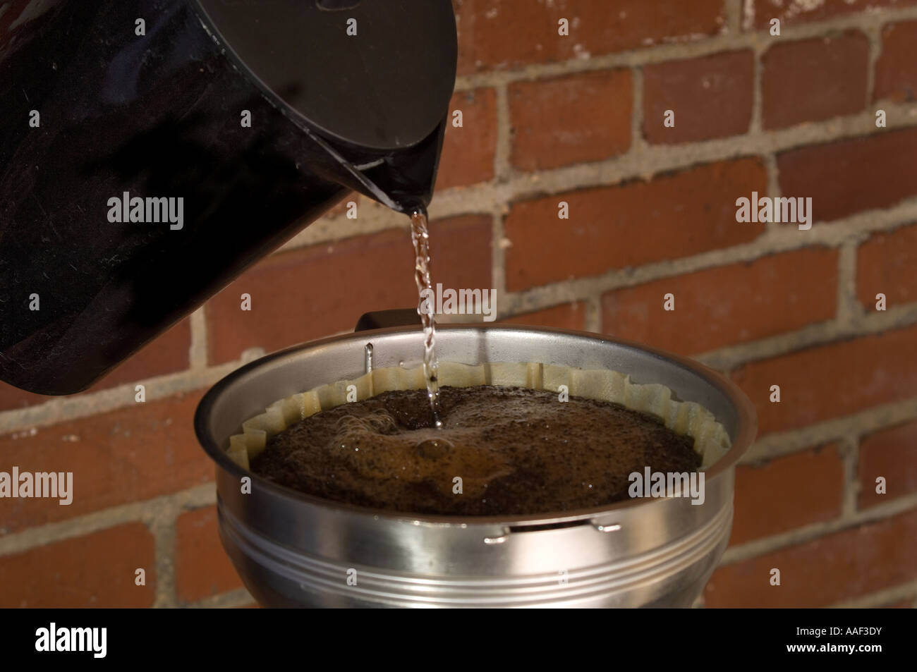 Pouring hot water into a coffee filter Stock Photo Alamy