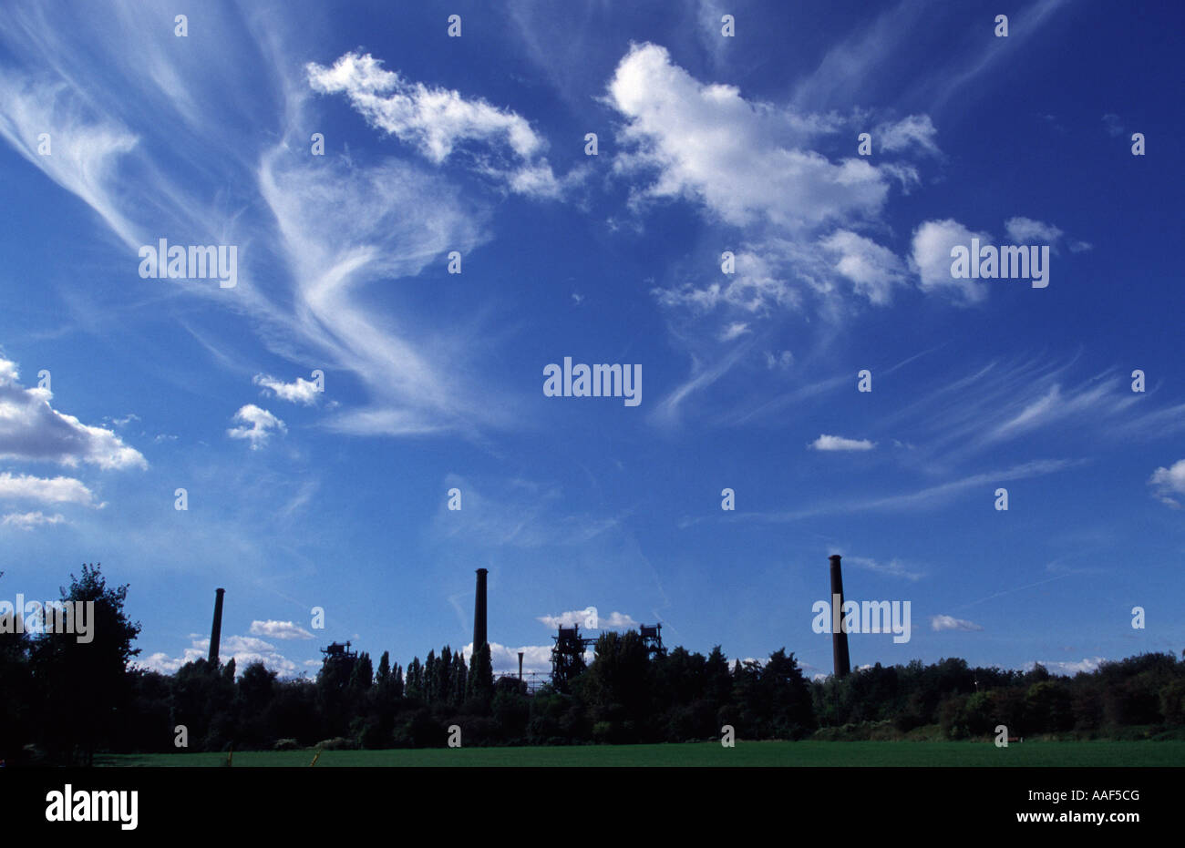 Landschafspark Duisburg Nord with towers and clouds Stock Photo
