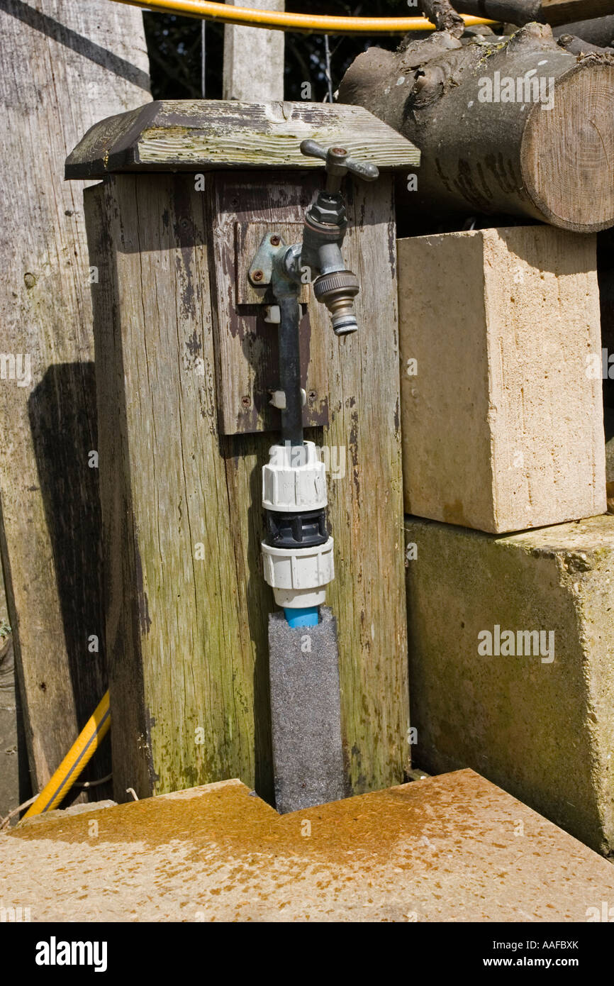 Water dripping from outside garden brass tap UK Stock Photo Alamy