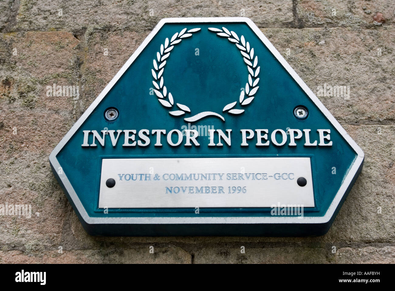 Investor in People plaque sign on wall of Wilderness Education Centre Gloucestershire UK Stock Photo