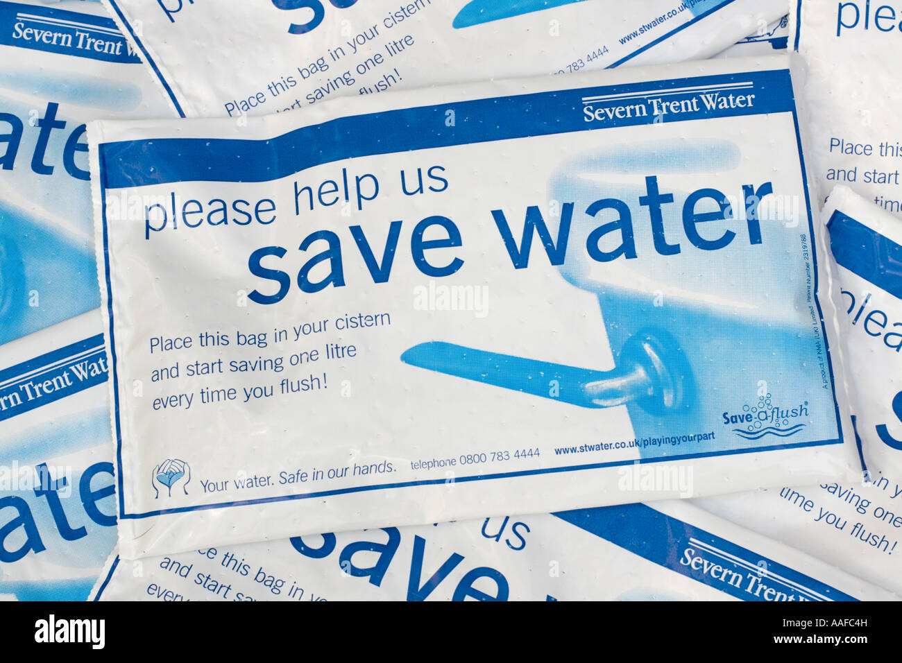 Water hippo saveaflush bags provided free by Severn Trent Water to conserve  water in toilet cistern UK Stock Photo - Alamy