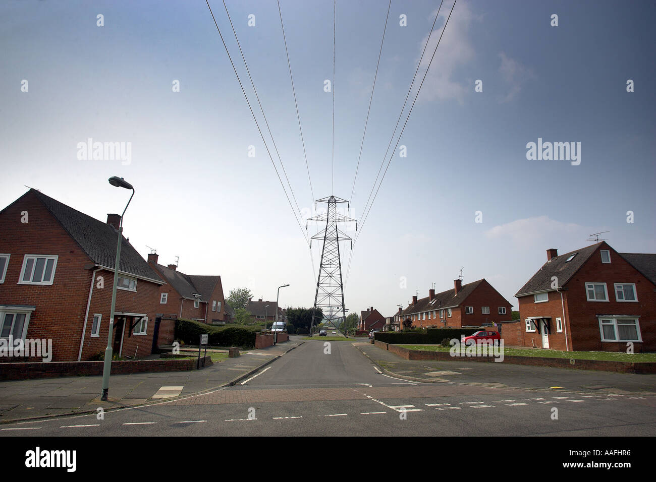 Electricity pylons in residential area of Exeter Stock Photo - Alamy