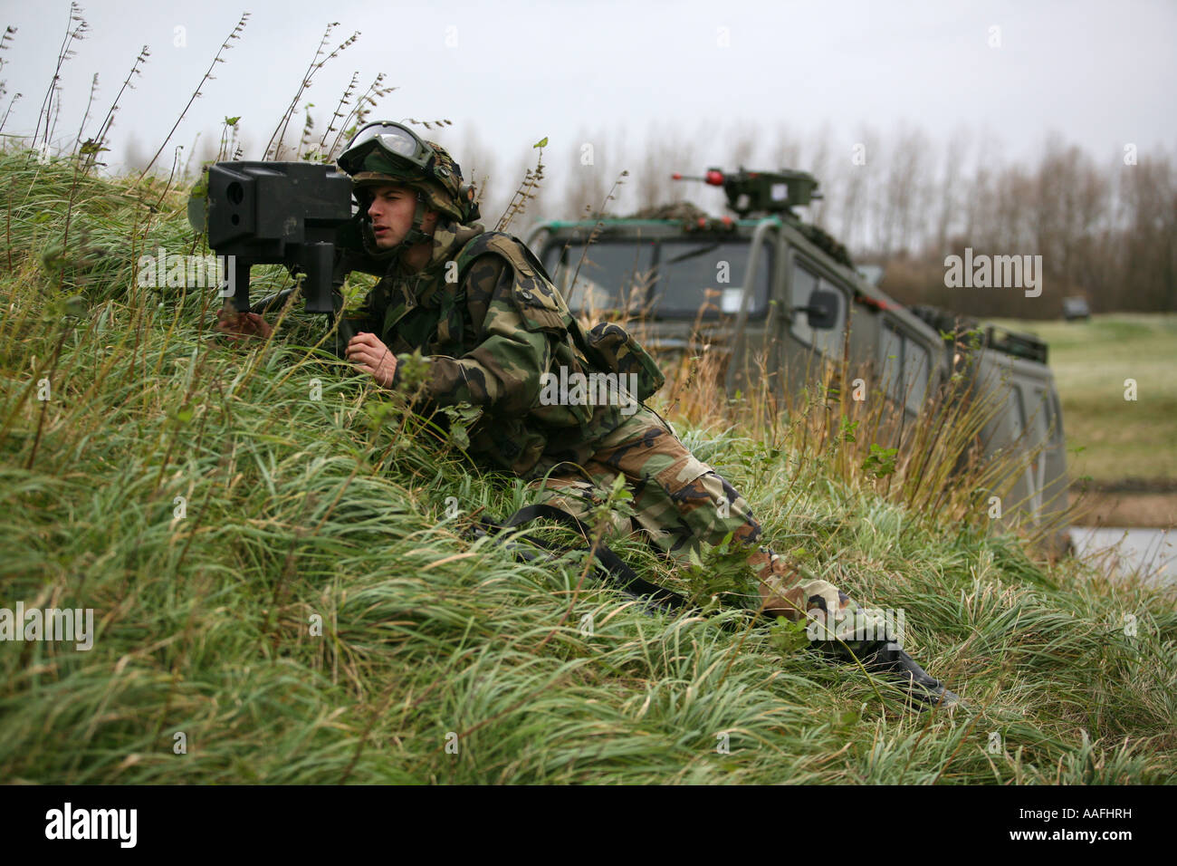 Soldiers simulating a warzone in Lauwersoog where a village is built  editorial use only no negative publicity Stock Photo