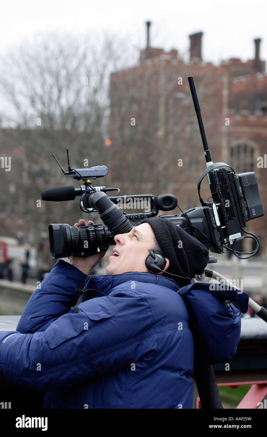 News camerman at work in London Stock Photo - Alamy