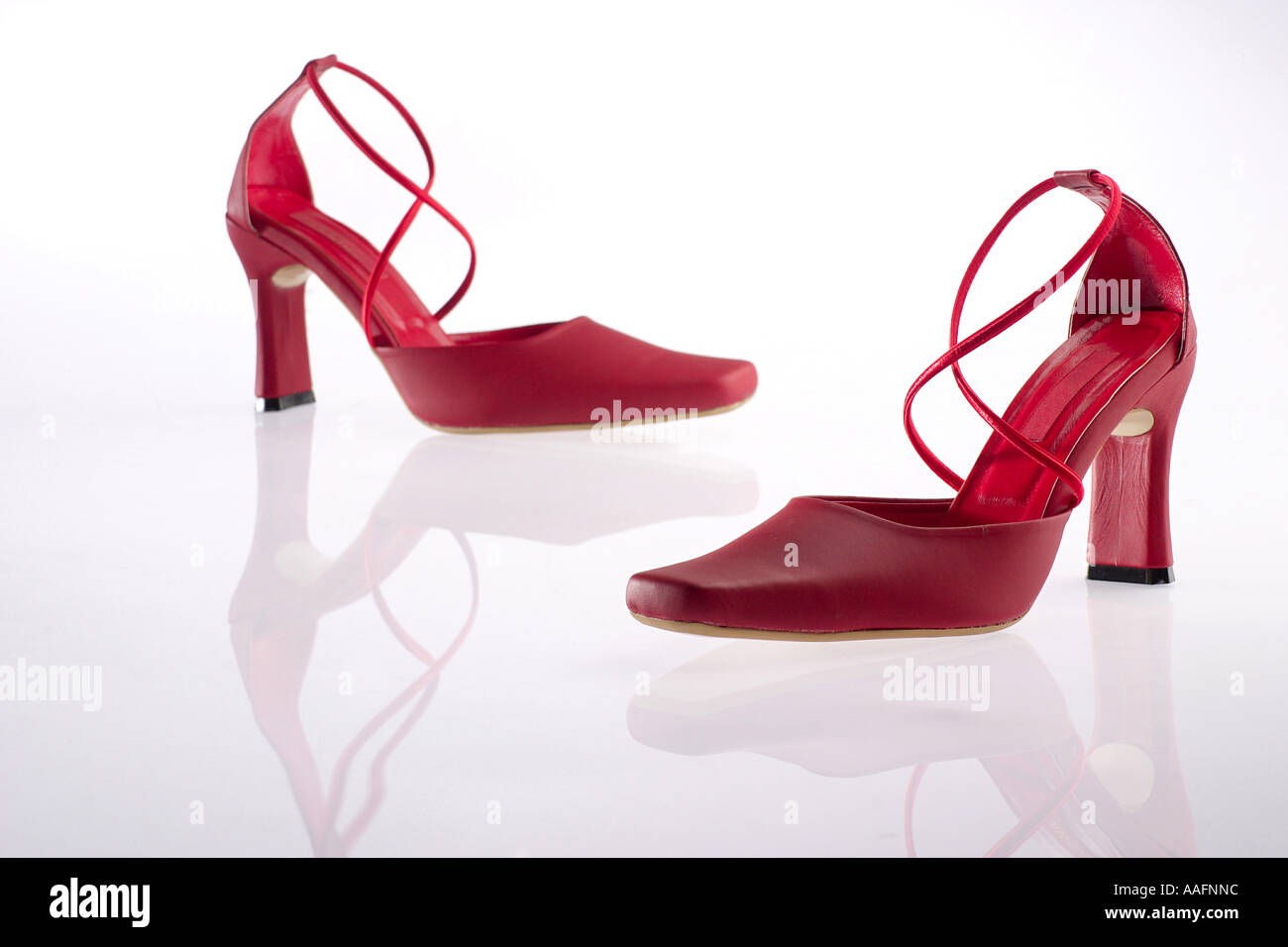 HPA78575 Red color ladies high heeled footwear stiletto fashion elegant shoe with reflection Stock Photo