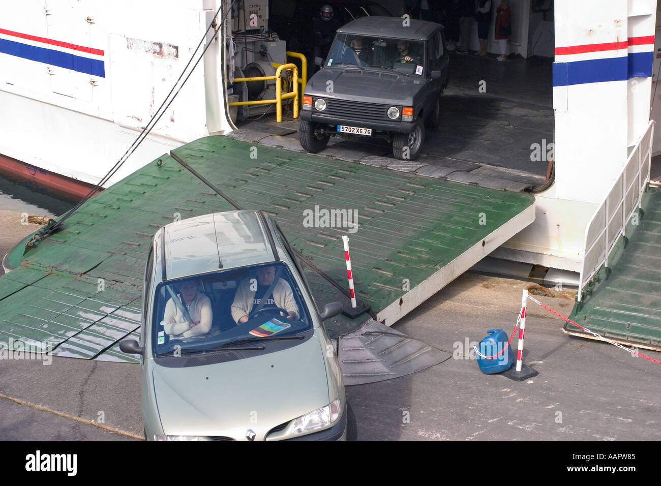 Cars leaving a car ferry france Stock Photo