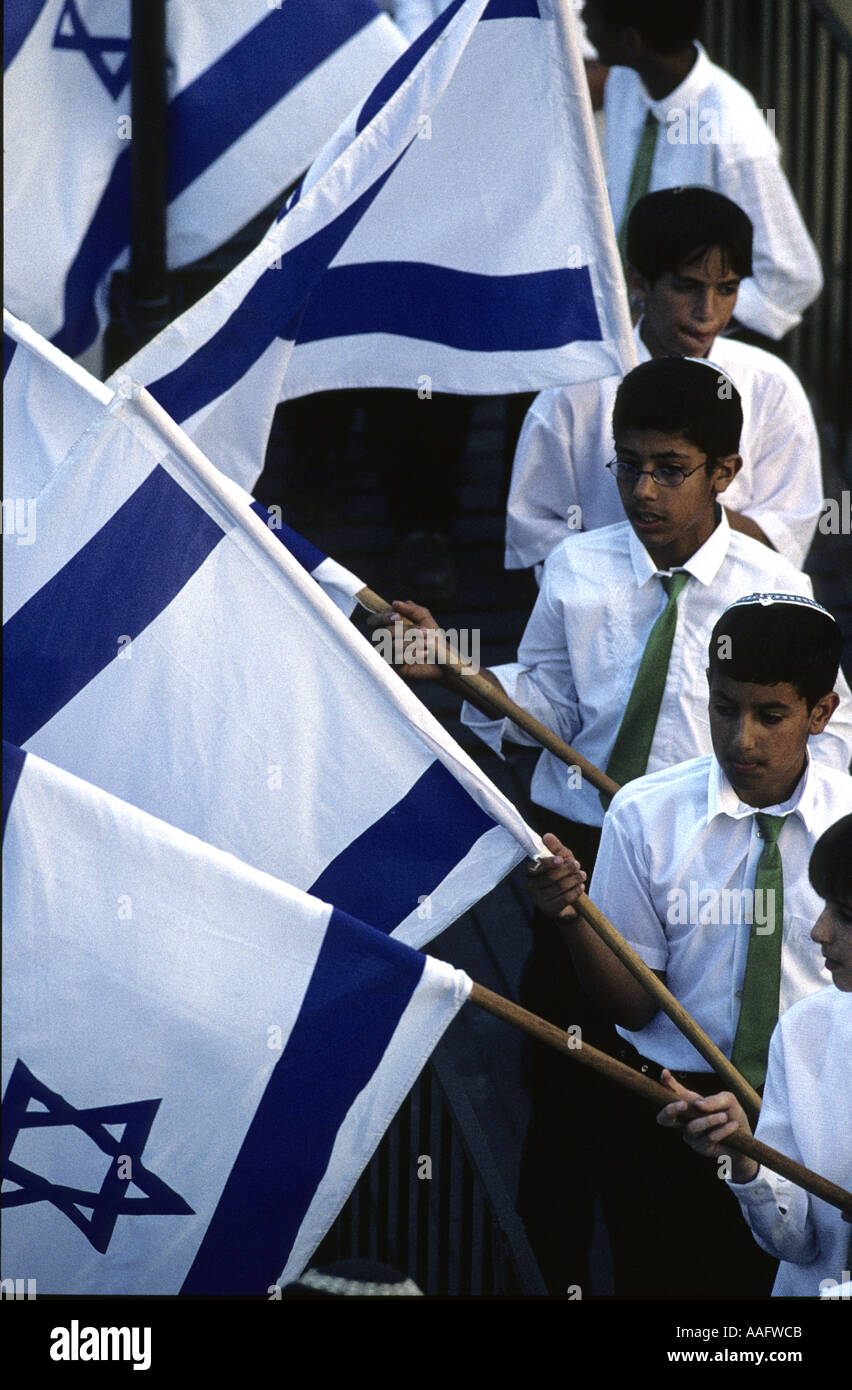 Youth display Israeli flags on parade in Jerusalem Israel Stock Photo