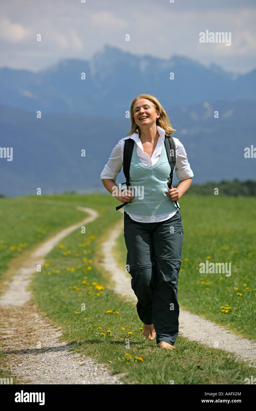 Mature woman walking near hi-res stock photography and images - Alamy