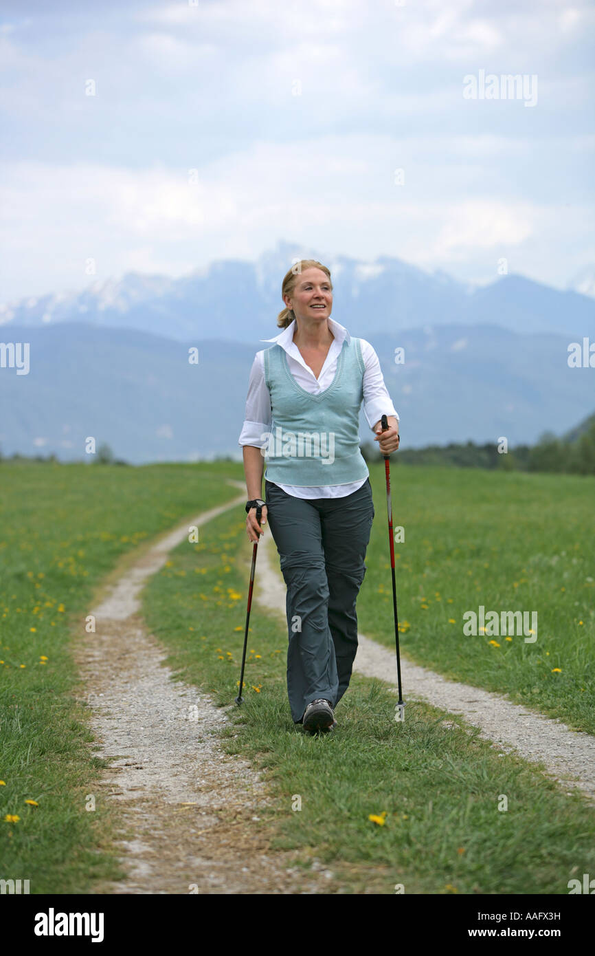 woman doing nordic walking, Frau beim Nordic Walking Stock Photo - Alamy