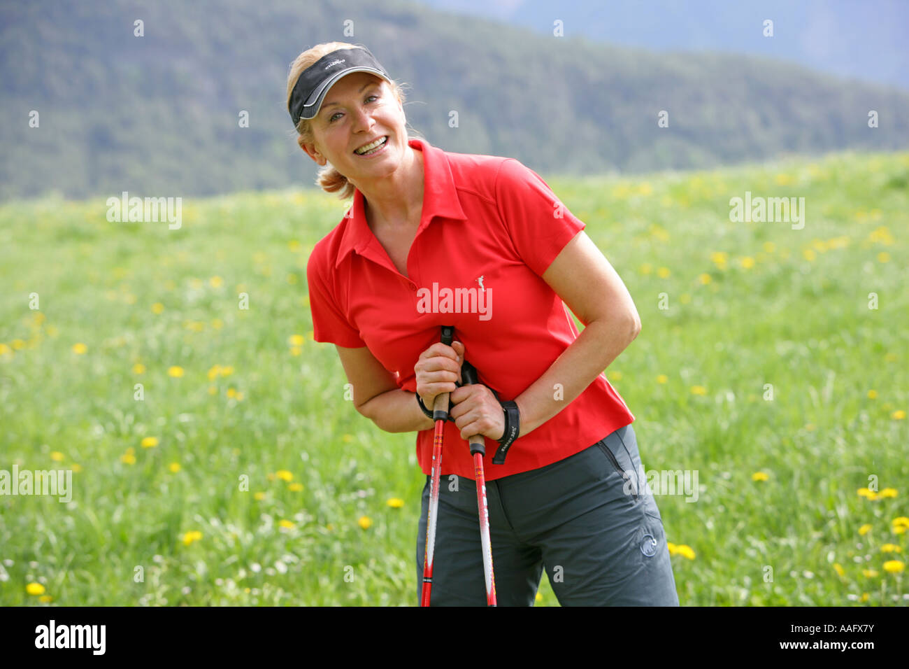 woman doing nordic walking, Frau beim Nordic Walking Stock Photo - Alamy