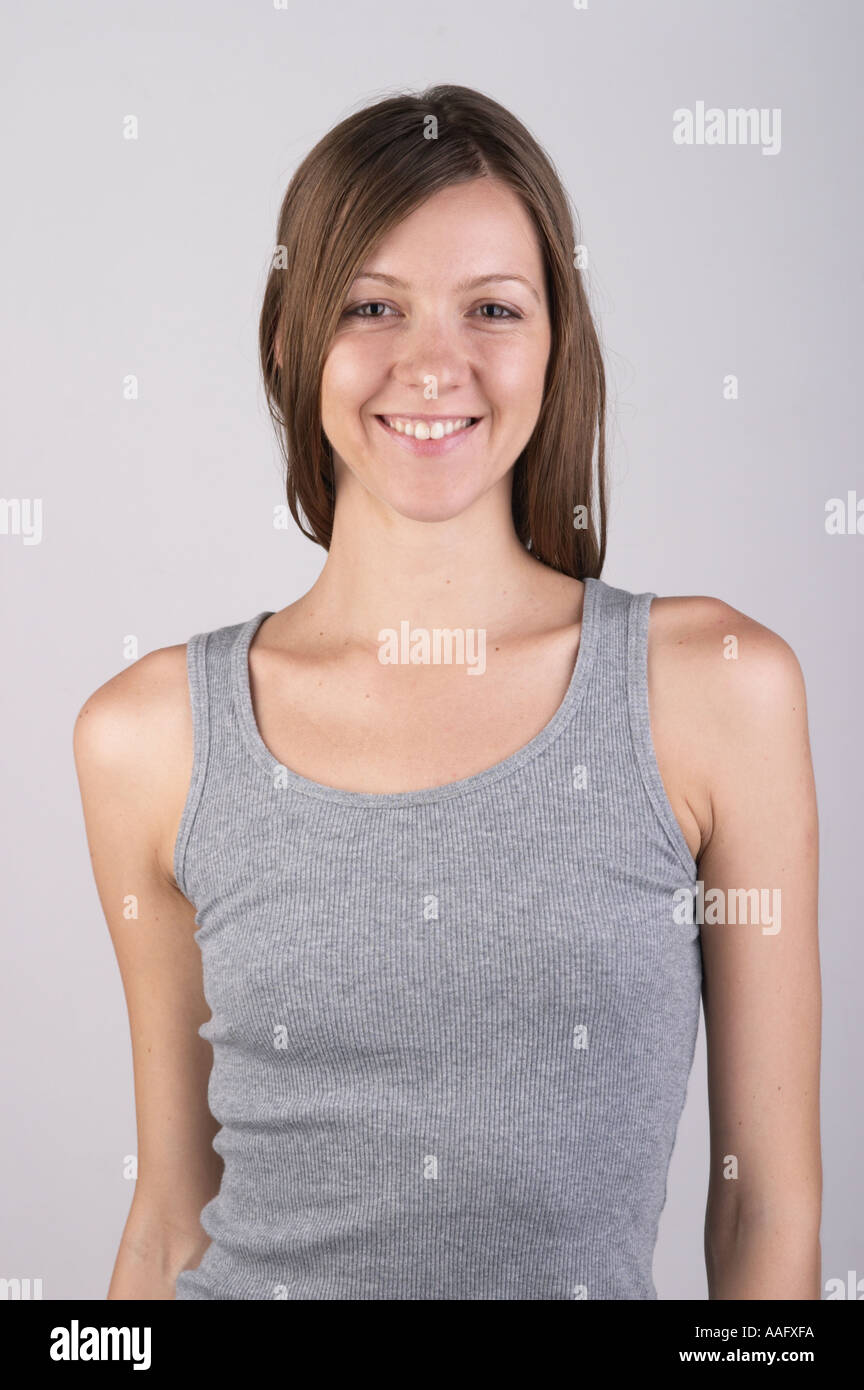 https://c8.alamy.com/comp/AAFXFA/girl-in-grey-vest-top-smiling-at-camera-AAFXFA.jpg