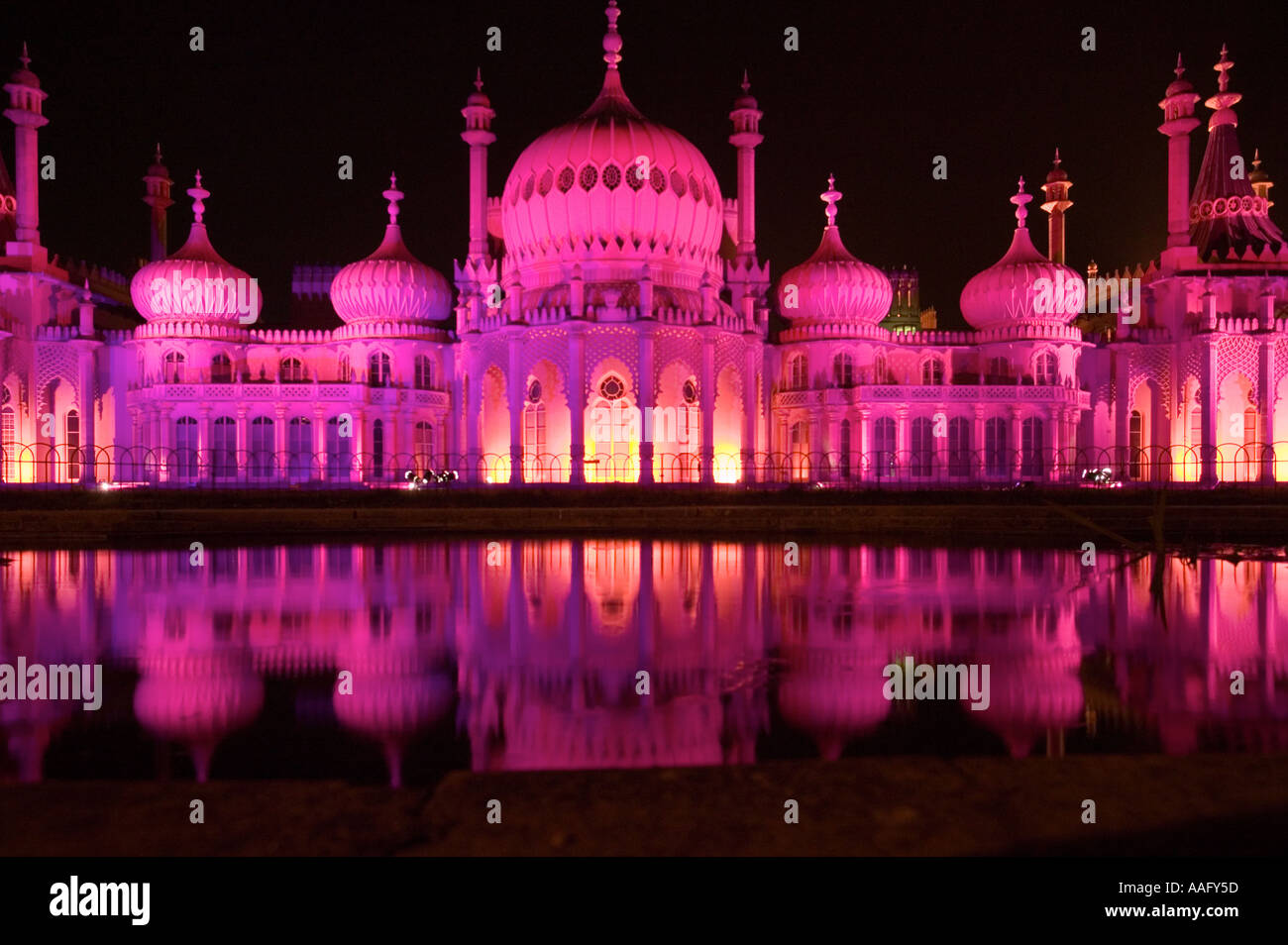 Royal Pavilion Brighton floodlit with pink lights by night to celebrate Gay Pride partially