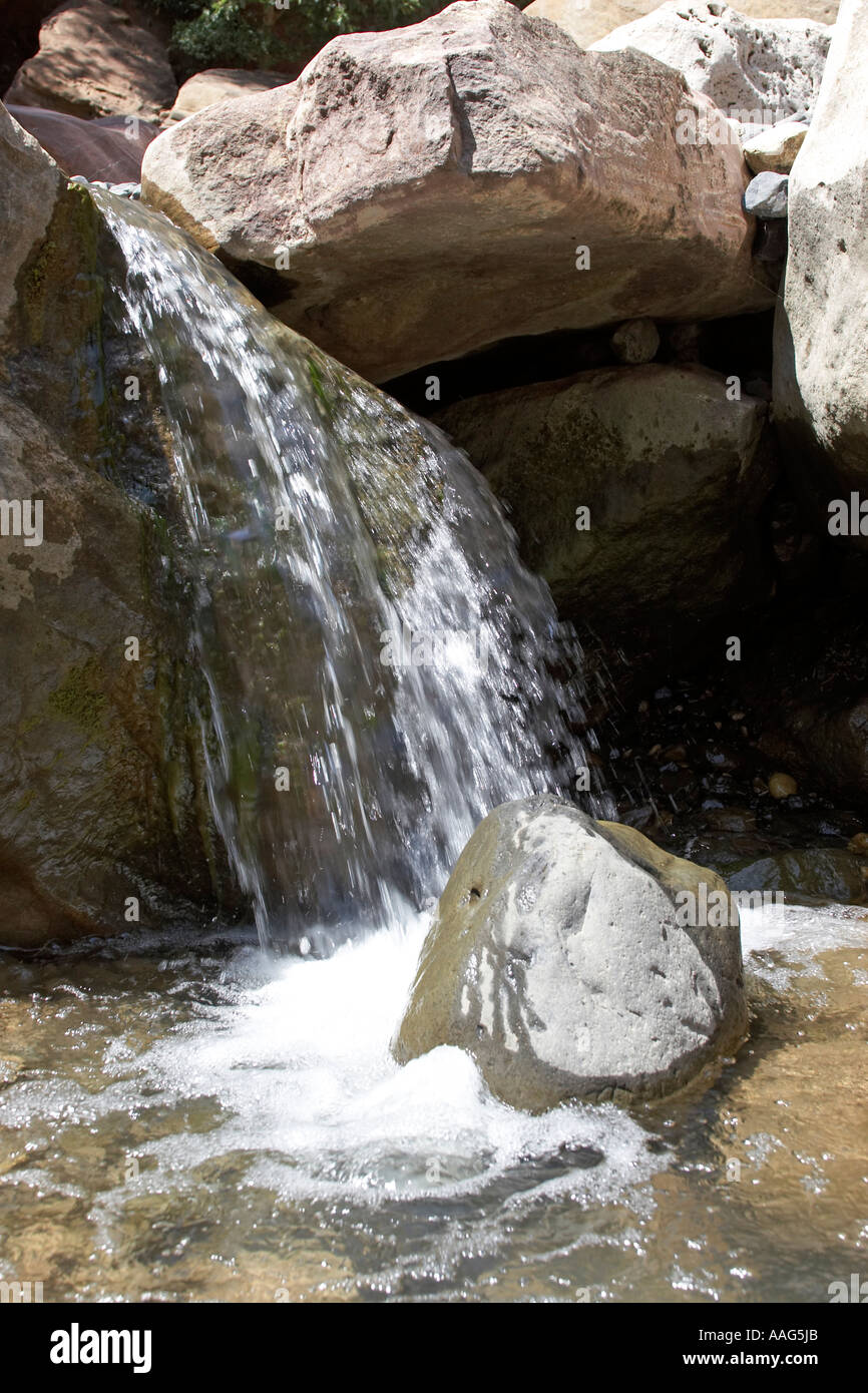 Mountain stream flowing over waterfall in river valley near Blue Nile ...