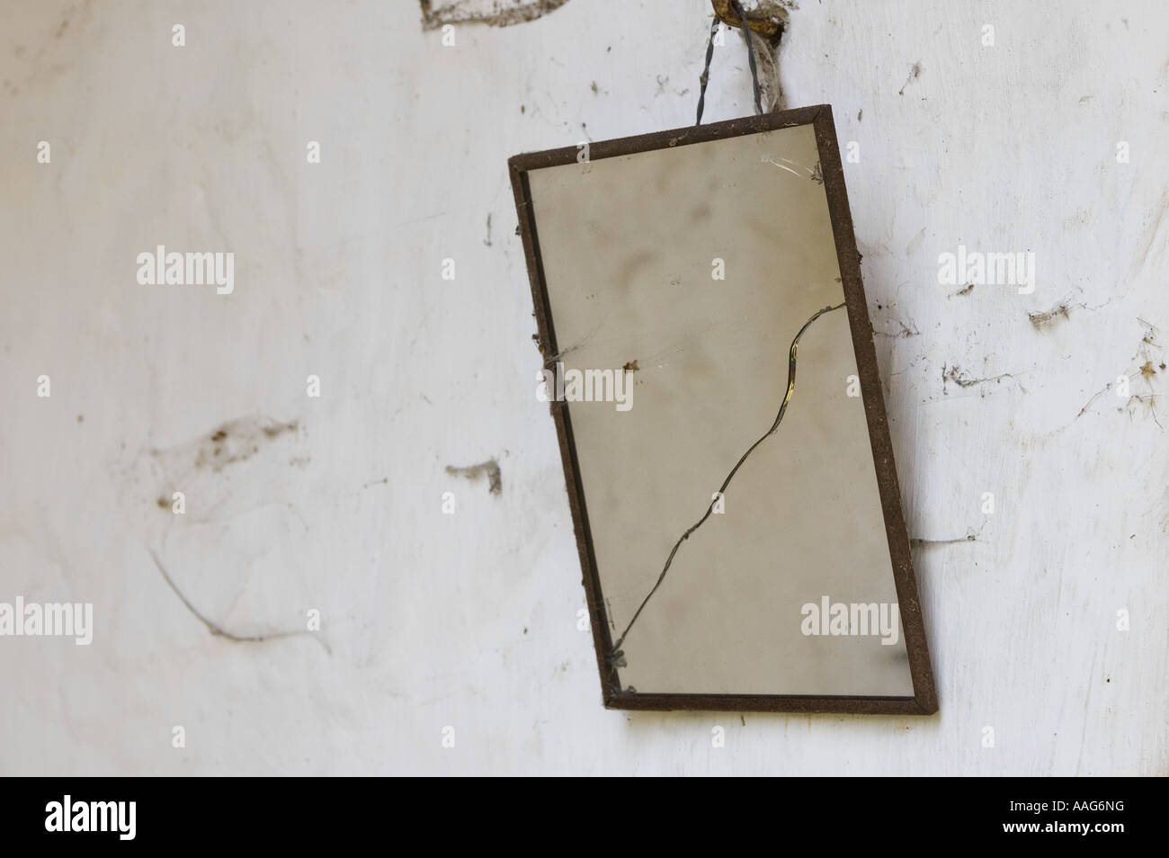close up of broken rusty mirror hanging on a wall Stock Photo - Alamy