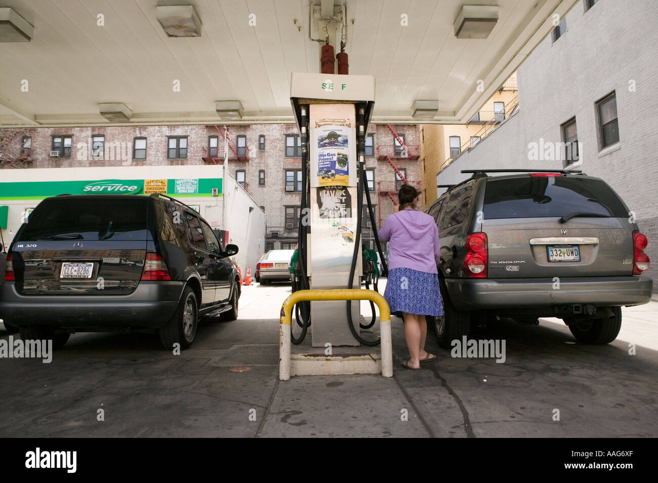 Filling up the car at a gas station in Harlem New York City USA April 2006 Stock Photo Alamy