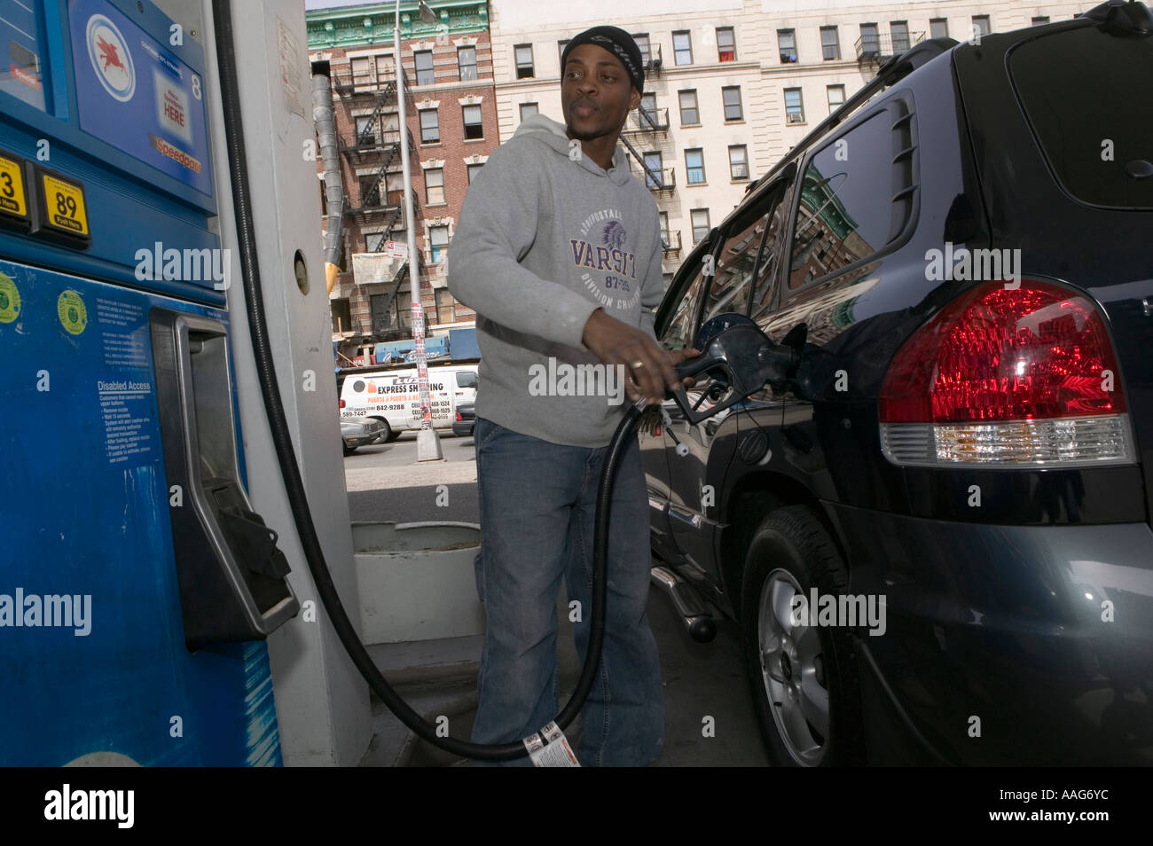 Filling up the car at a gas station in Harlem New York City USA April ...