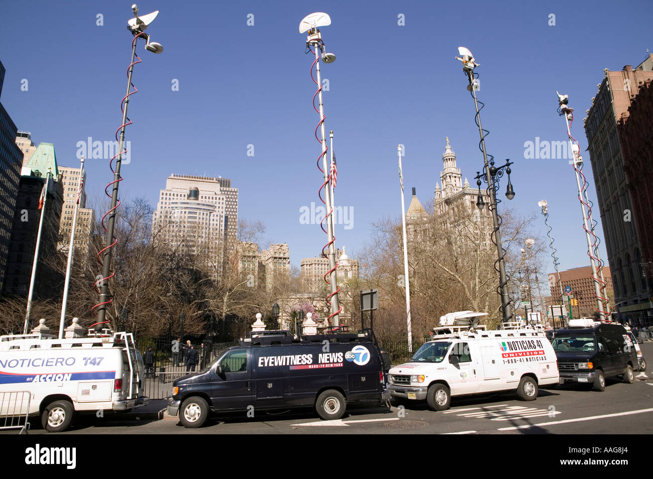 tv station vans with antennas on extended telescopic arms in New York City USA April 2006 Stock Photo