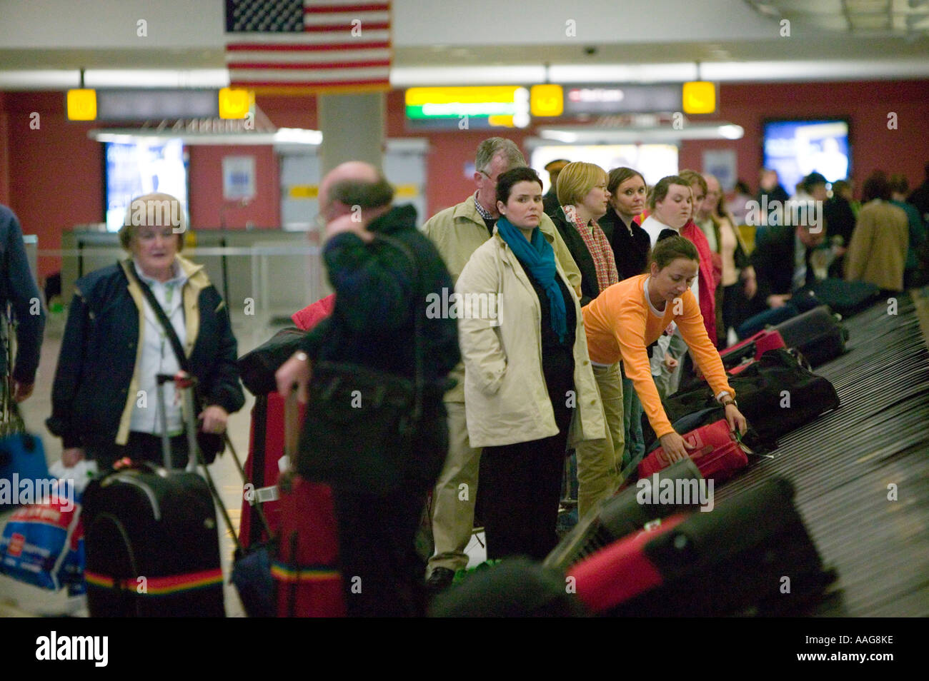 Arriving Passengers Wait For Their Luggage At Terminal 4 Of Jfk Airport