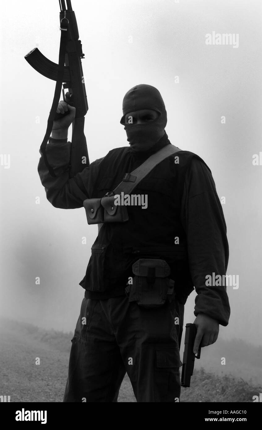 Balaclava terrorist machine gun Black and White Stock Photos & Images