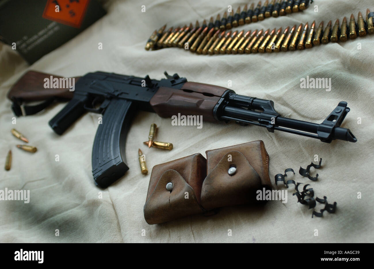 AK47 Kalashnikov rifle with ammunition and parts of webbing uniform Stock Photo