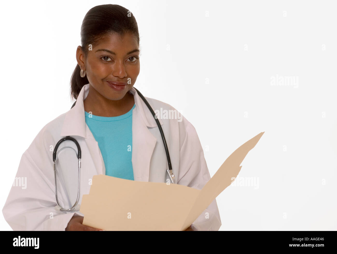 Smiling African American female general practitioner holding patient folder in medical office, USA. Stock Photo