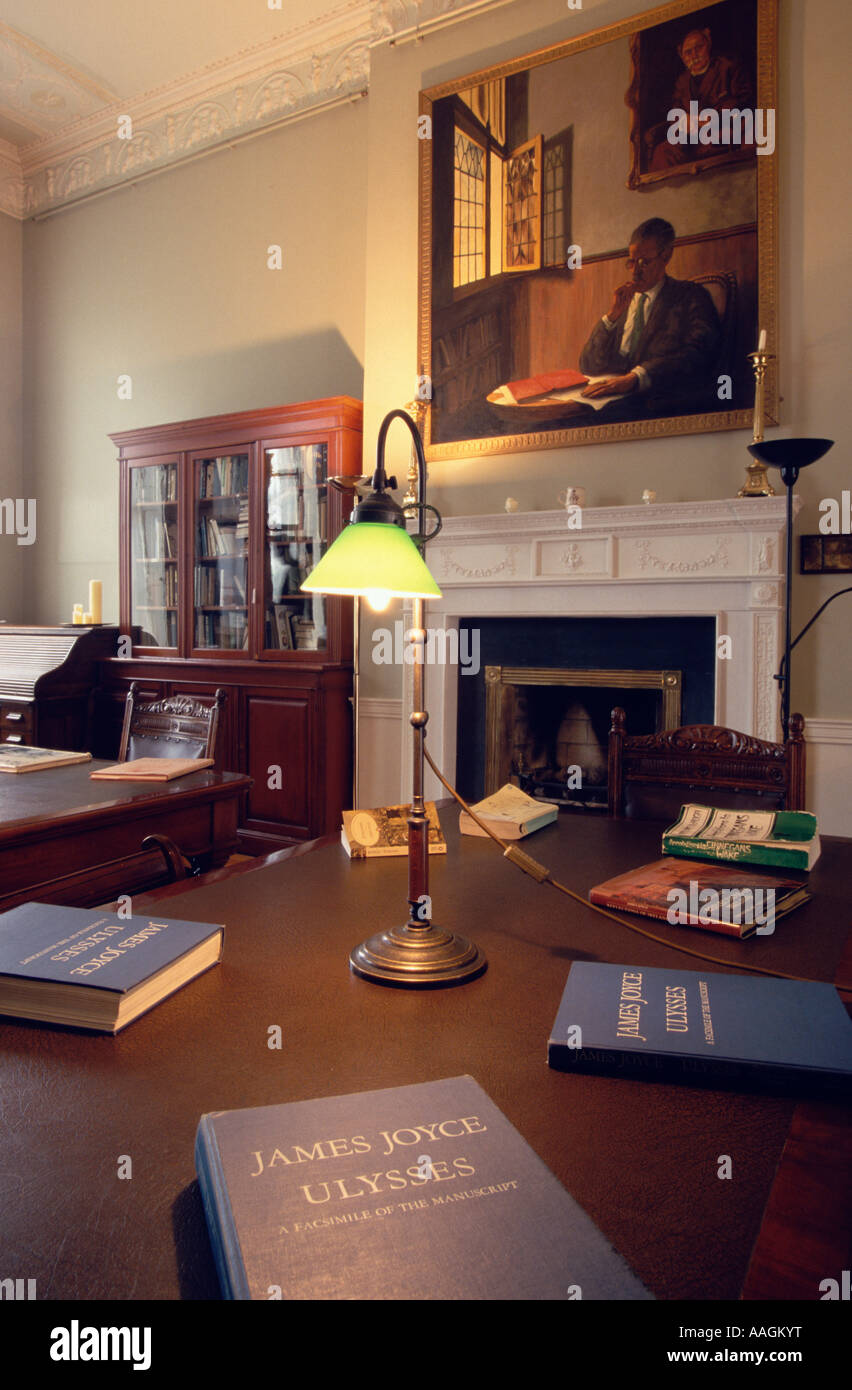 Table with lamp illuminating three volumes of Ulysses James Joyce