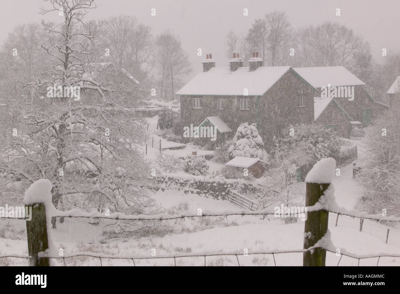 a farm house after a heavy winter snowfall, Skelwyth Fold, Ambleside, Cumbria, UK Stock Photo